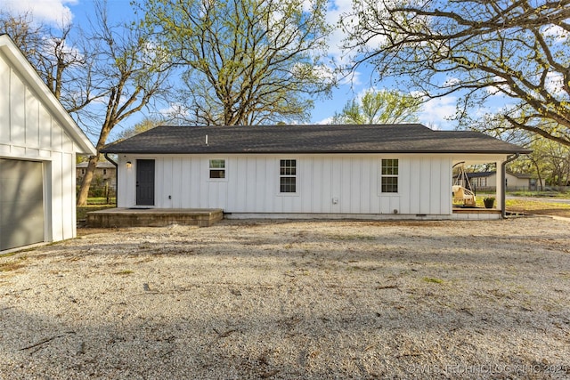 900 S Johnston, Ada, OK 74820 - back of house featuring board and batten siding and a shingled roof