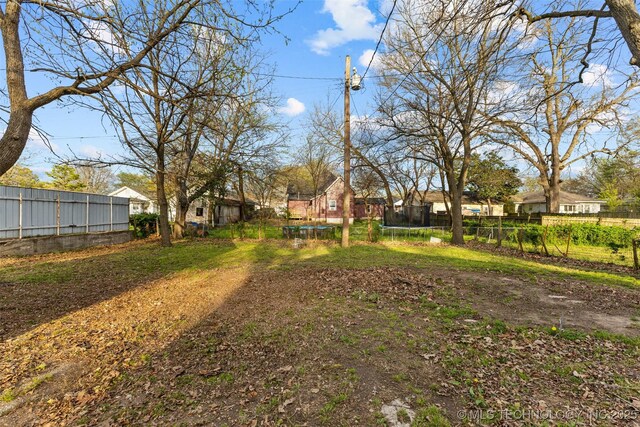 900 S Johnston, Ada, OK 74820 - view of yard with a trampoline