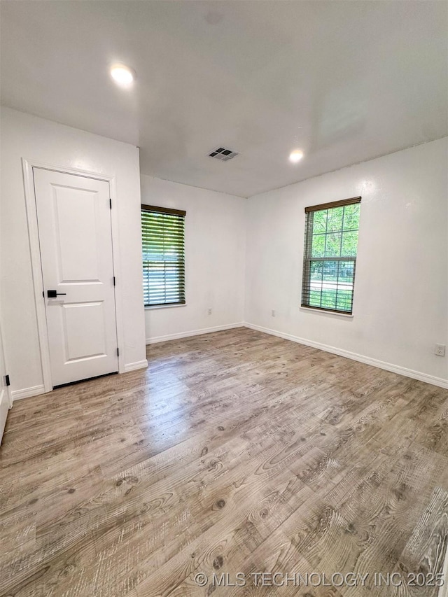 900 S Johnston, Ada, OK 74820 - spare room featuring wood finished floors, baseboards, and recessed lighting