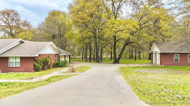 view of road with driveway