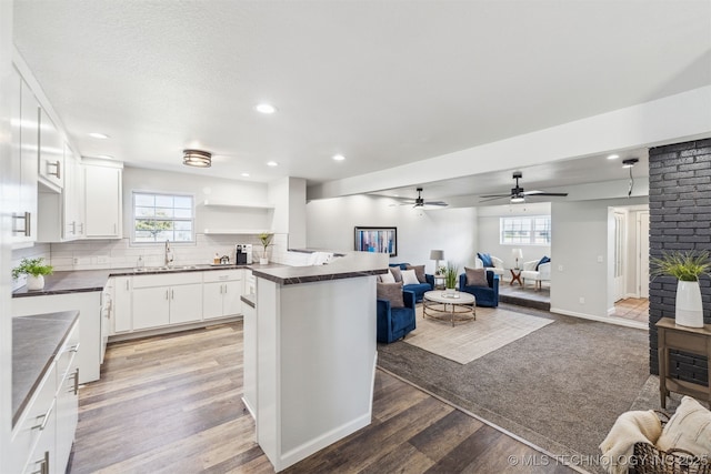 18446 E 112th St, Owasso, OK 74055 - kitchen with open shelves, recessed lighting, a sink, dark countertops, and open floor plan