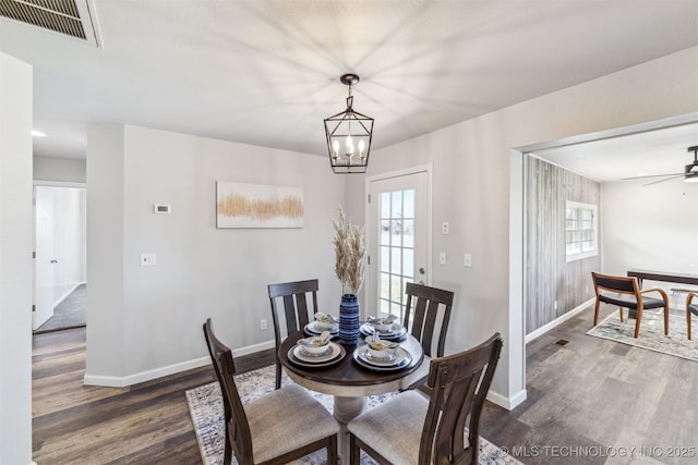 18446 E 112th St, Owasso, OK 74055 - dining room with a healthy amount of sunlight, visible vents, baseboards, and wood finished floors