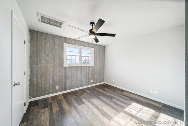 18446 E 112th St, Owasso, OK 74055 - empty room featuring visible vents, baseboards, a ceiling fan, and wood finished floors