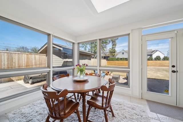 2947 S Peoria Ave, Tulsa, OK 74114 - sunroom featuring tile patterned floors and a skylight