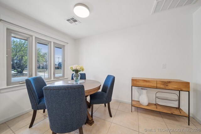 2947 S Peoria Ave, Tulsa, OK 74114 - dining area featuring visible vents, baseboards, and light tile patterned floors
