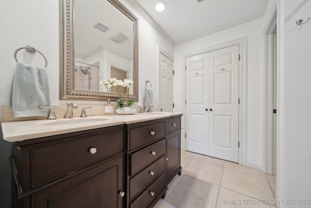 2947 S Peoria Ave, Tulsa, OK 74114 - full bath featuring tile patterned floors, double vanity, visible vents, ornamental molding, and a sink