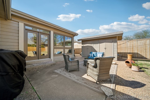 2947 S Peoria Ave, Tulsa, OK 74114 - view of patio / terrace featuring fence, an outbuilding, french doors, and a shed