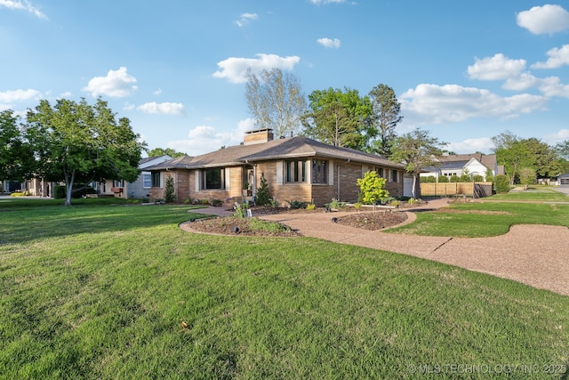 2947 S Peoria Ave, Tulsa, OK 74114 - ranch-style house featuring an attached garage, brick siding, and a front yard