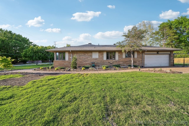 2947 S Peoria Ave, Tulsa, OK 74114 - ranch-style house with fence, an attached garage, driveway, brick siding, and a front yard