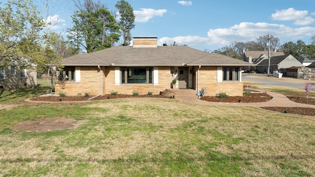 2947 S Peoria Ave, Tulsa, OK 74114 - view of front of house with a chimney, a front lawn, and a shingled roof
