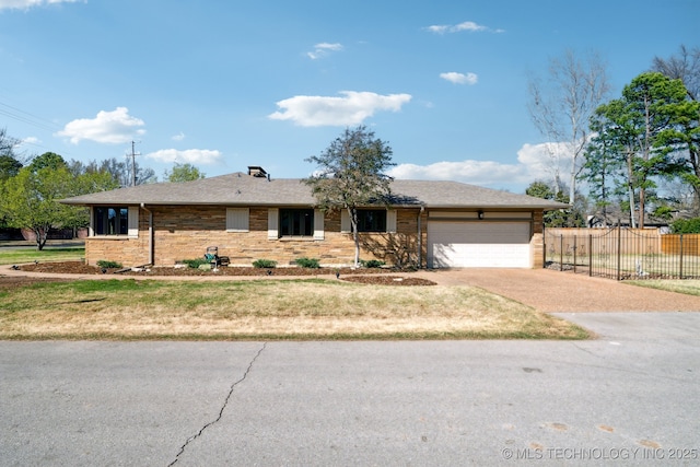 2947 S Peoria Ave, Tulsa, OK 74114 - ranch-style home featuring a front lawn, fence, driveway, and a garage
