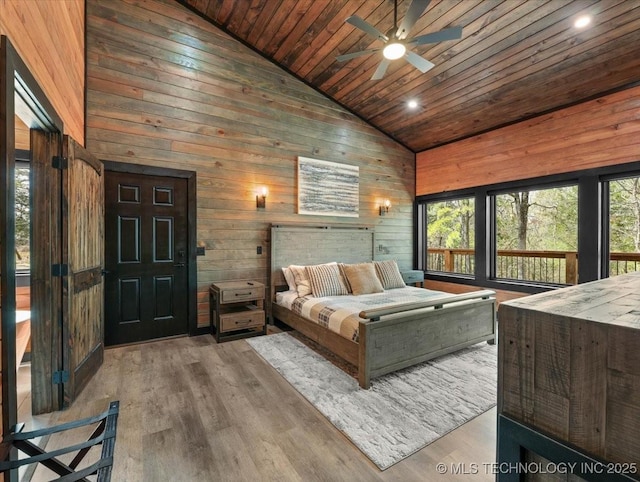 1739 NW 136th Rd, Wilburton, OK 74578 - bedroom with wood ceiling, high vaulted ceiling, multiple windows, and wood finished floors