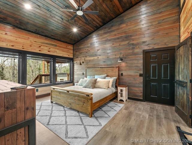 1739 NW 136th Rd, Wilburton, OK 74578 - bedroom with wood ceiling, high vaulted ceiling, wooden walls, and wood finished floors