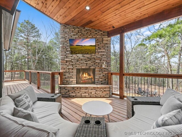 1739 NW 136th Rd, Wilburton, OK 74578 - deck with an outdoor living space with a fireplace