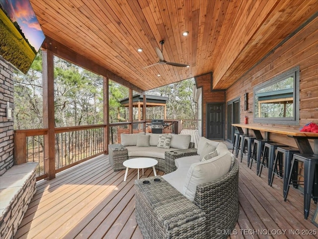 1739 NW 136th Rd, Wilburton, OK 74578 - wooden deck featuring outdoor lounge area, outdoor dry bar, and a ceiling fan