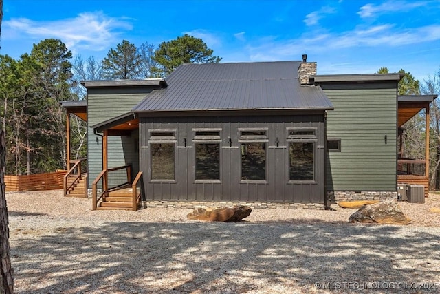 1739 NW 136th Rd, Wilburton, OK 74578 - exterior space with a chimney, central air condition unit, and metal roof