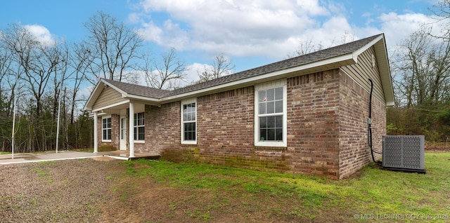 464888 E 1010th Rd, Sallisaw, OK 74955 - view of property exterior with brick siding and a yard