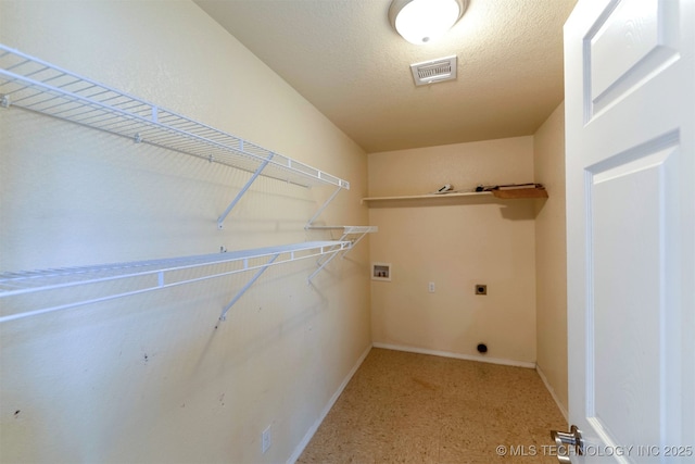464888 E 1010th Rd, Sallisaw, OK 74955 - laundry room with laundry area, electric dryer hookup, a textured ceiling, visible vents, and washer hookup