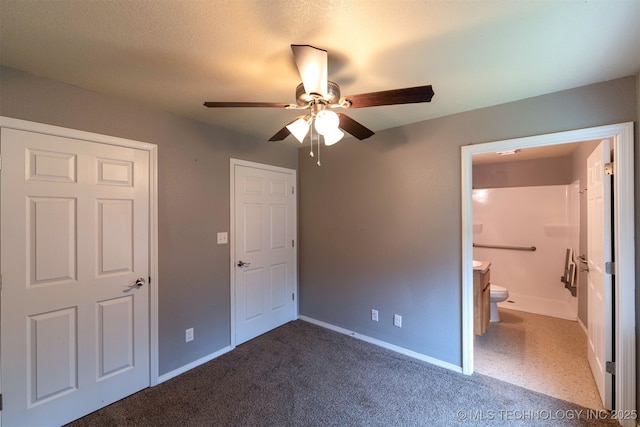 464888 E 1010th Rd, Sallisaw, OK 74955 - unfurnished bedroom featuring baseboards, ensuite bathroom, a textured ceiling, carpet floors, and ceiling fan