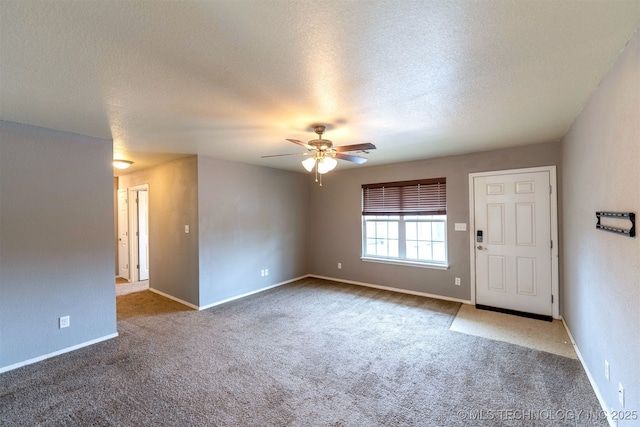 464888 E 1010th Rd, Sallisaw, OK 74955 - unfurnished room with a textured ceiling, ceiling fan, baseboards, and carpet