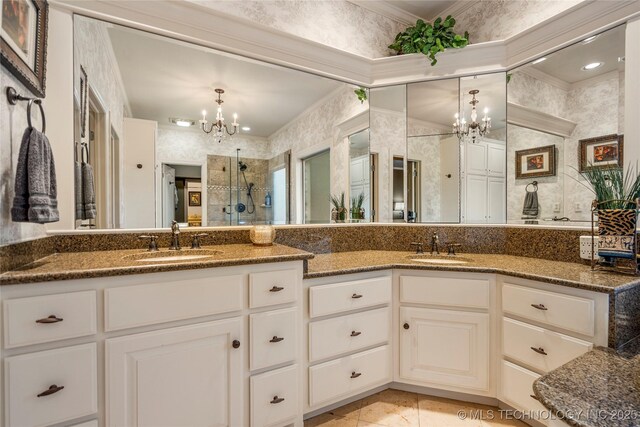 6323 E 111th Pl, Tulsa, OK 74137 - full bathroom featuring a chandelier, ornamental molding, double vanity, and a stall shower