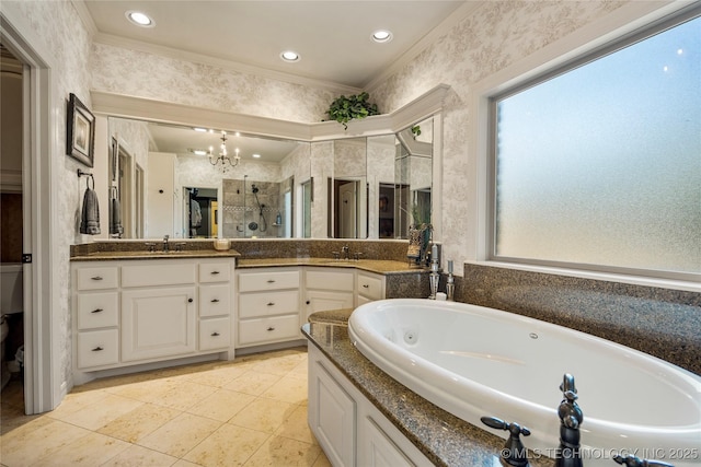 6323 E 111th Pl, Tulsa, OK 74137 - full bath featuring a chandelier, double vanity, a shower stall, a tub with jets, and wallpapered walls