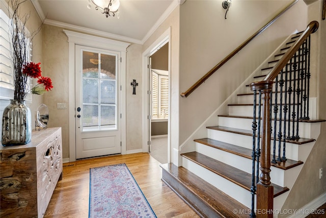 6323 E 111th Pl, Tulsa, OK 74137 - foyer entrance with light wood-style floors, ornamental molding, and stairs