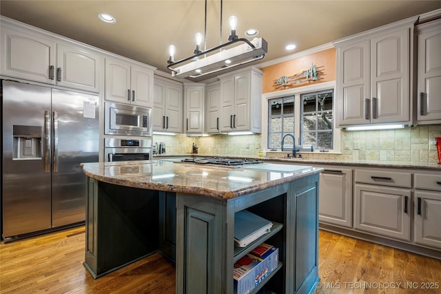 6323 E 111th Pl, Tulsa, OK 74137 - kitchen with appliances with stainless steel finishes, a kitchen island, light stone counters, decorative backsplash, and recessed lighting
