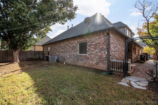6323 E 111th Pl, Tulsa, OK 74137 - view of side of home featuring brick siding and a shingled roof