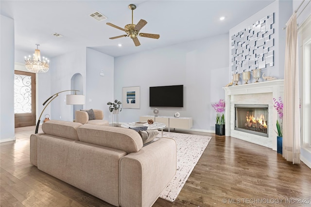 3316 W Jackson St, Broken Arrow, OK 74012 - living area with wood finished floors, ceiling fan with notable chandelier, a glass covered fireplace, and recessed lighting