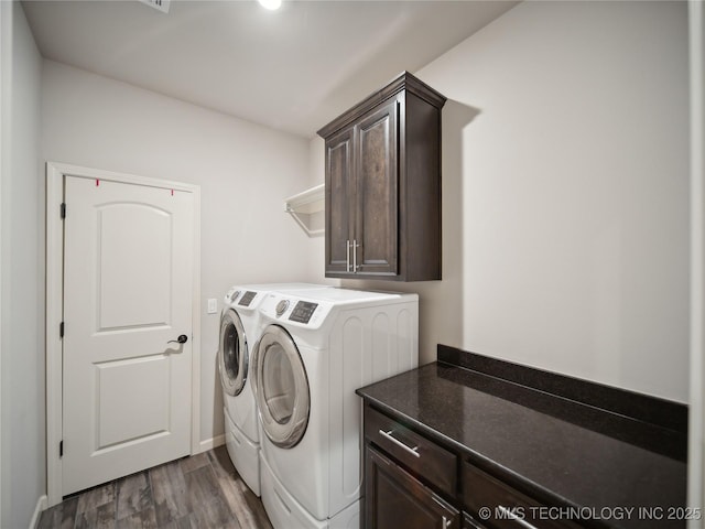 3316 W Jackson St, Broken Arrow, OK 74012 - laundry room with washing machine and clothes dryer, baseboards, dark wood finished floors, and cabinet space