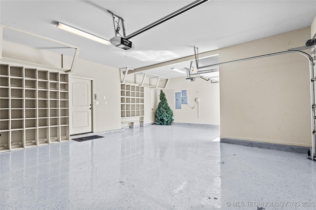 3316 W Jackson St, Broken Arrow, OK 74012 - garage with electric panel, baseboards, and a garage door opener