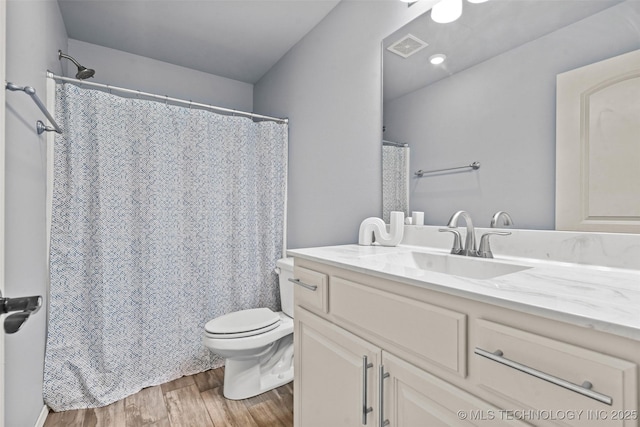 3316 W Jackson St, Broken Arrow, OK 74012 - bathroom featuring visible vents, toilet, vanity, and wood finished floors