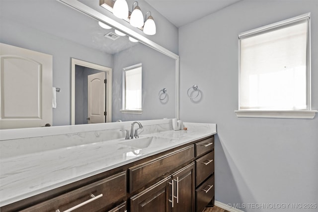 3316 W Jackson St, Broken Arrow, OK 74012 - bathroom featuring vanity, visible vents, and a healthy amount of sunlight