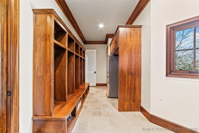 mudroom with baseboards and ornamental molding