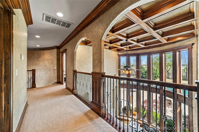 hallway with visible vents, beam ceiling, carpet floors, ornamental molding, and recessed lighting