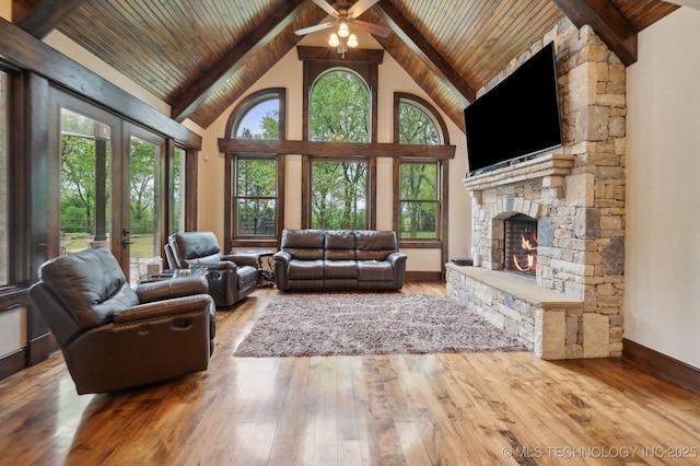 9931 N Chadford Rd, Owasso, OK 74055 - living area featuring a fireplace, french doors, a wood ceiling with exposed beams, high vaulted ceiling, and wood-type flooring