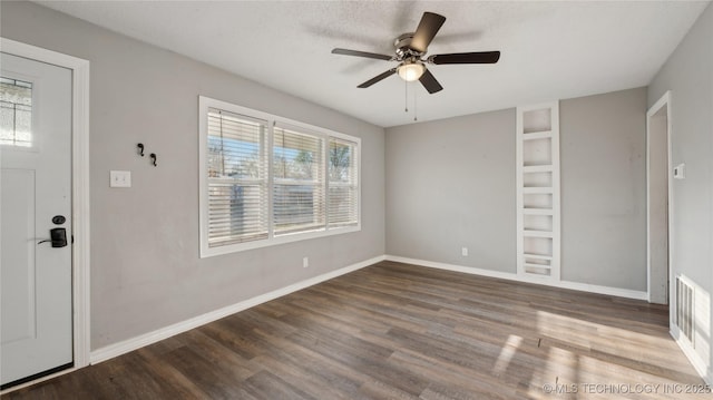 345 N Pine, Dewey, OK 74029 - foyer entrance with wood finished floors, a ceiling fan, and baseboards