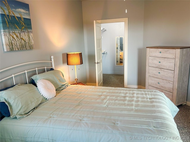 carpeted bedroom with baseboards
