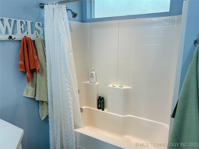 full bathroom featuring shower / bathtub combination with curtain
