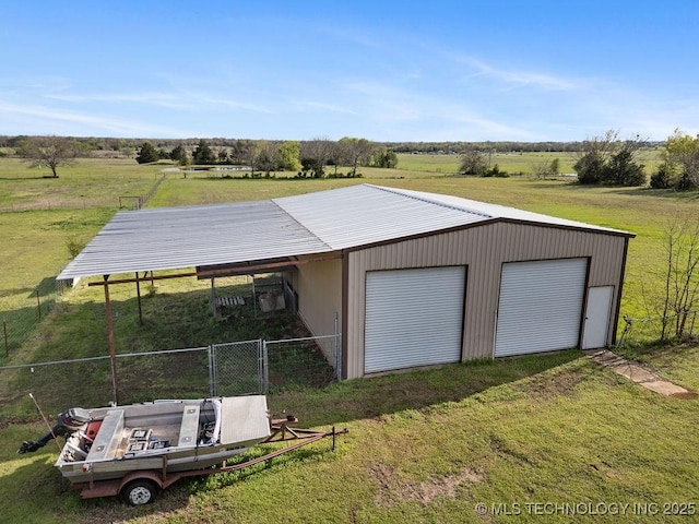 511 Tandy Walker, Silo, OK 74701 - garage with a rural view, fence, and a detached garage