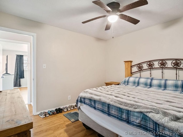 511 Tandy Walker, Silo, OK 74701 - bedroom with baseboards, a ceiling fan, and wood finished floors