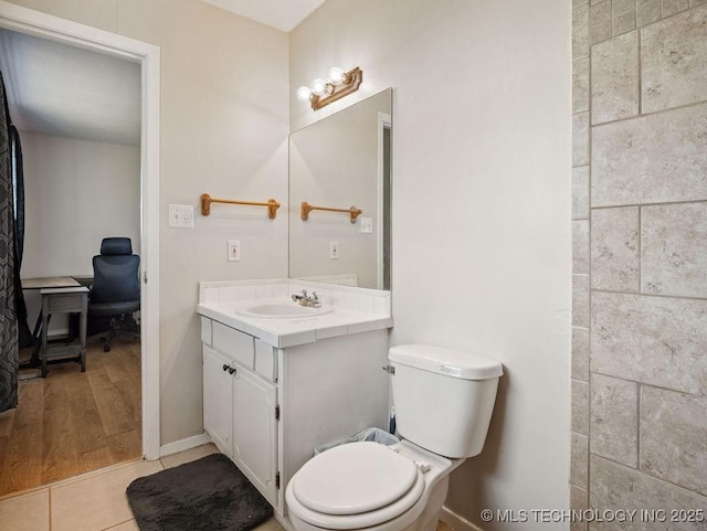 511 Tandy Walker, Silo, OK 74701 - bathroom featuring toilet, vanity, baseboards, and tile patterned flooring