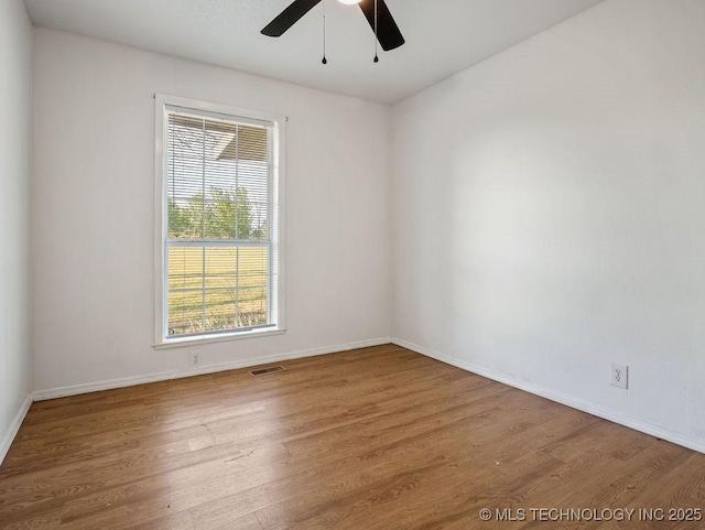 511 Tandy Walker, Silo, OK 74701 - unfurnished room featuring wood finished floors, ceiling fan, baseboards, and visible vents