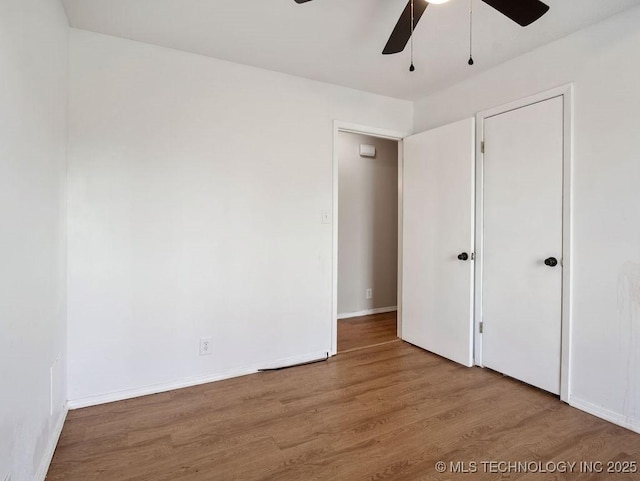 511 Tandy Walker, Silo, OK 74701 - unfurnished bedroom with baseboards, a ceiling fan, and wood finished floors
