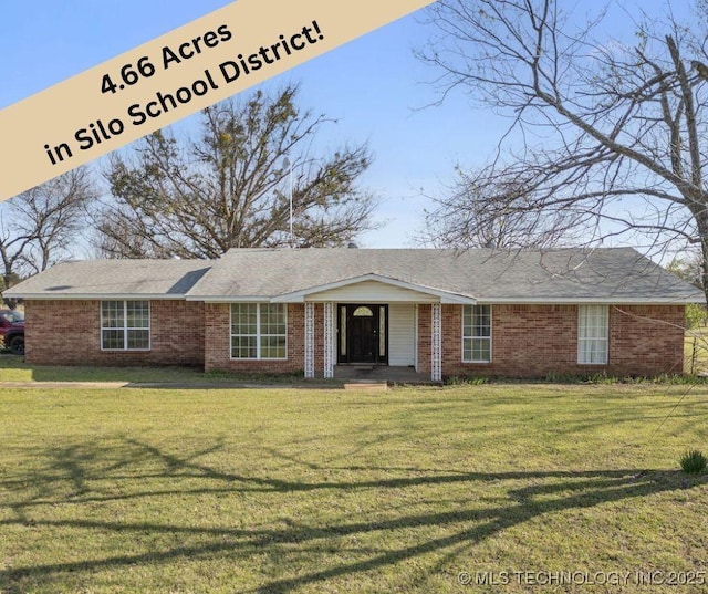 511 Tandy Walker, Silo, OK 74701 - ranch-style house featuring brick siding and a front lawn