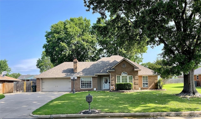 ranch-style house with fence, an attached garage, a chimney, concrete driveway, and a front yard