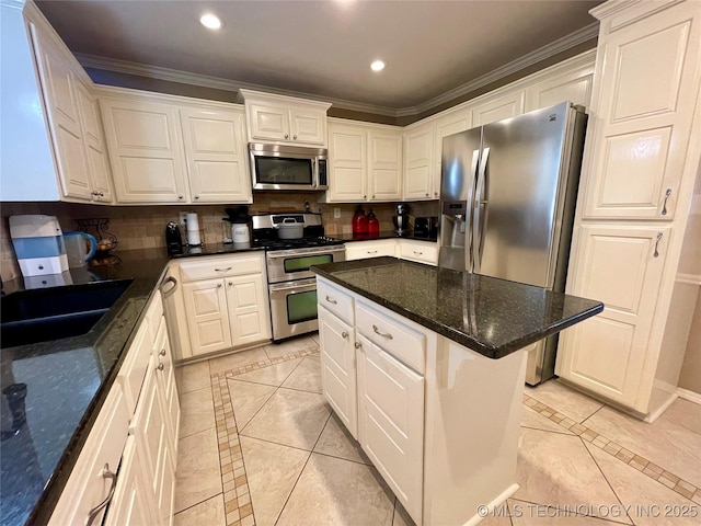 kitchen featuring decorative backsplash, white cabinetry, stainless steel appliances, and recessed lighting