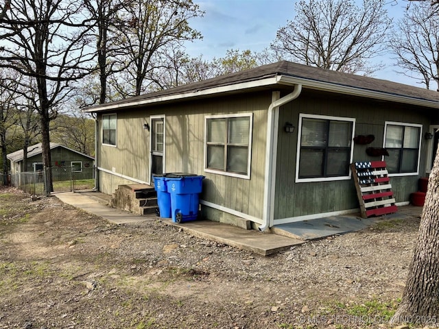 view of property exterior with fence