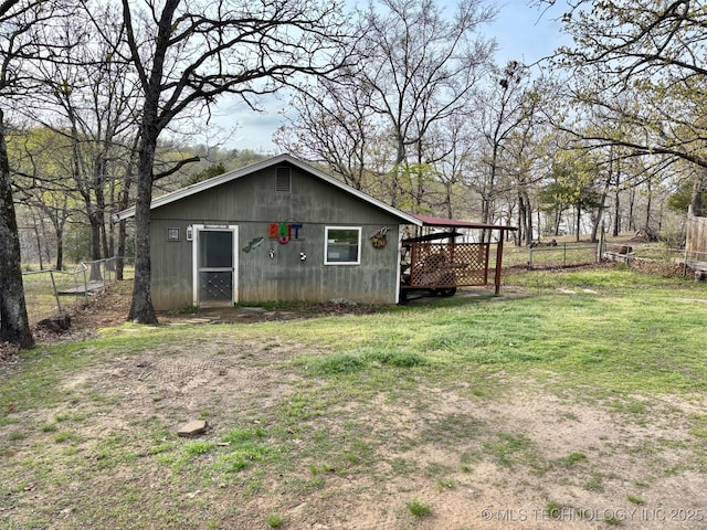 view of outdoor structure with fence